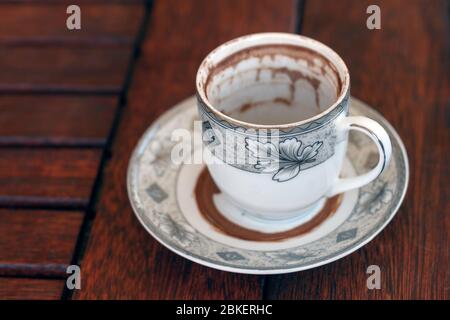 Finished Cup of Turkish Coffee on wooden background waiting for fortune telling Stock Photo