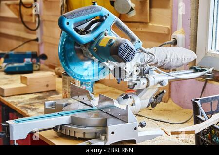 Circular saw (miter saw) photographed in the workshop atmosphere Stock Photo