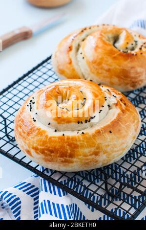 Freshly baked pie with spinach and cheese from flaky dough. Stock Photo