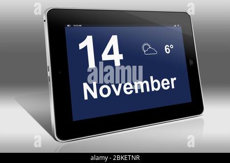 A tablet computer displays a calendar in German language with the date November 14th | Ein Tablet-Computer zeigt das Datum 14. November Stock Photo