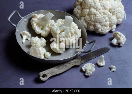 Cauliflower in bowl and knife, food photography, studio shot, Germany Stock Photo