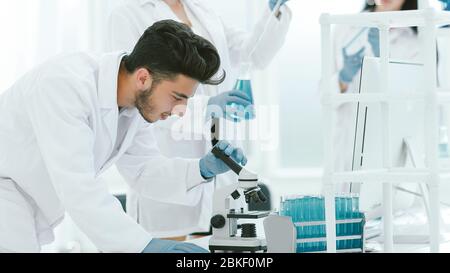 group of young scientist experimenting in the laboratory Stock Photo