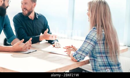 young woman sitting at interview in office. Stock Photo