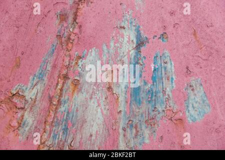 Rusty pink metal wall background with streaks of rust, texture background Stock Photo