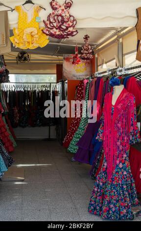 September 9, 2019, El Rocio, Andalusia, Spain. Shop with many traditional colorful spanish flamenco dresses Stock Photo