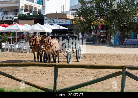 September 9, 2019, El Rocio, Andalusia, Spain. Small old town in Donana national park with sandy roads and squares, horse riding and white church Stock Photo