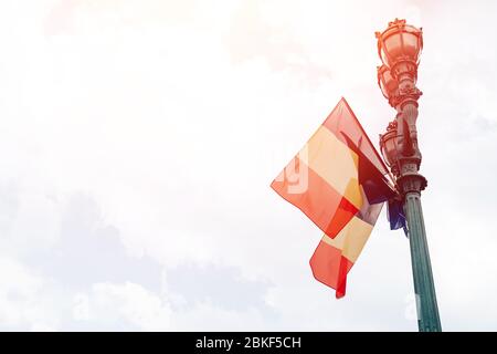 Old houses and square of city Brussels in Belgium, flags European Union. Stock Photo