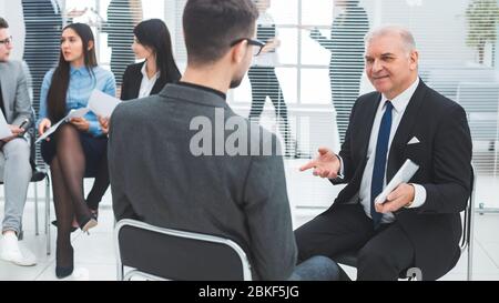 business man explaining something to his colleague. Stock Photo