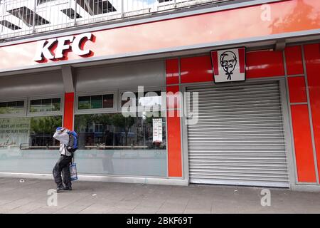 Hamburg, Germany. 03rd May, 2020. A closed branch of KFC (Kentucky Fried Chiken) with a lowered rolling gate can be seen on the Reeperbahn on St. Pauli. Most of the restaurants, cafes and pubs in the Hanseatic city have closed due to the Corona crisis. Credit: Bodo Marks/dpa/Bodo Marks/dpa/Alamy Live News Stock Photo