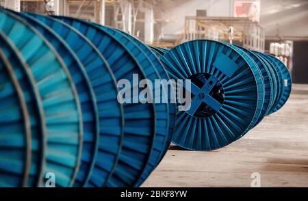 Heavy industry metallurgy concept. Reel for winding metal or copper wires electricity. Stock Photo