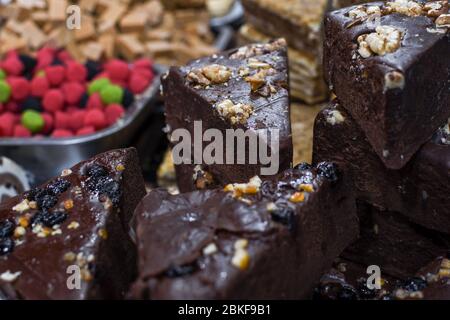 Sugar free, gluten free, lactose free piece of chocolate dessert cake bar. Stack or pile or homemade dessert on the counter top of bakery or pastry, f Stock Photo