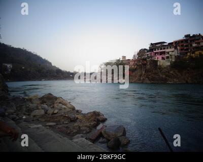 Ganges Riverbank clean water flowing in rishikesh, India Stock Photo