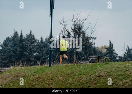 Well built middle aged athlete during a running exercise Stock Photo
