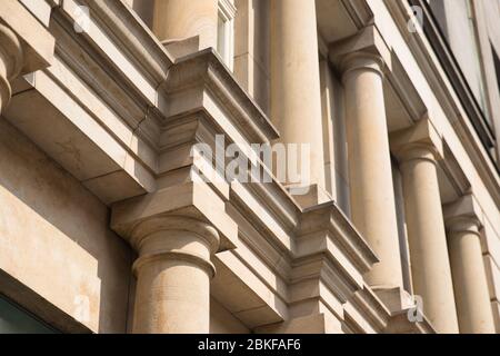 Stone columns of classical European style Doric capital close up. Play shadow and light, rhythm, meter Stock Photo
