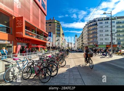 People on Landstraber Hauptstrabe  - main street in Landstrabe district, running along Wien Mitte train station. Stock Photo