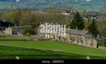 High view of Burley Woodhead hamlet (traditional terraced stone cottages & Hermit pub) on scenic rural valley hillside - West Yorkshire, England, UK. Stock Photo