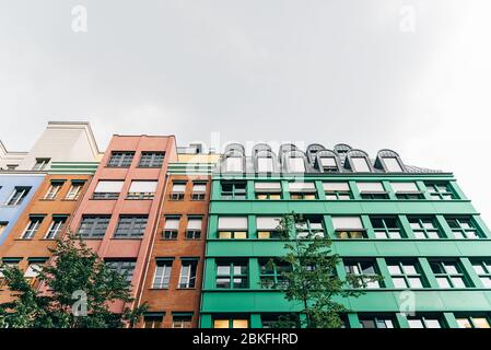 Berlin, Germany - July 29, 2019: Colorful residential buildings in Quartier Schutzenstrasse designed by italian architect Aldo Rossi Stock Photo