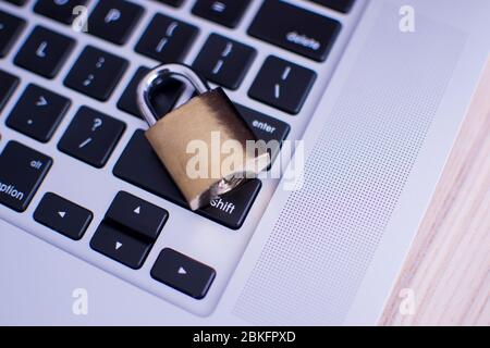 Padlock on computer keyboard. Network Security, data security and antivirus protection PC. Some employees usually forget to lock their computers. Stock Photo