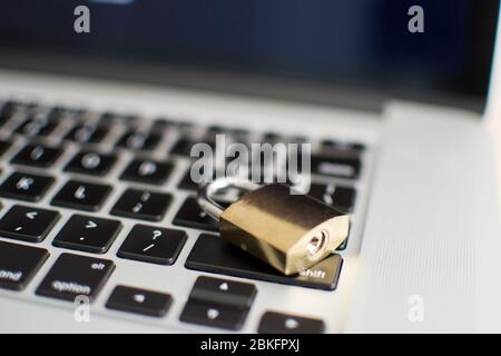 Padlock on computer keyboard. Network Security, data security and antivirus protection PC. Some employees usually forget to lock their computers. Stock Photo
