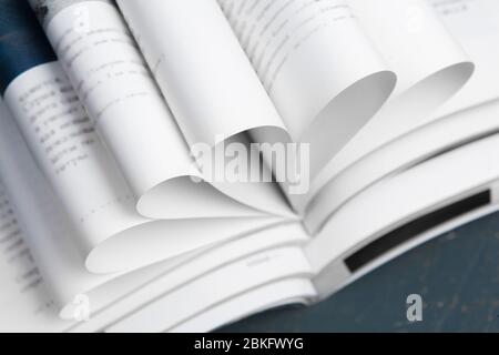 Close up stacking magazine place on table background Stock Photo