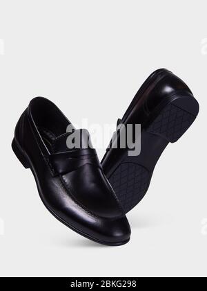 Classic men's shoes with a pointed toe and a thin sole without lace isolated on a white background. Stock Photo