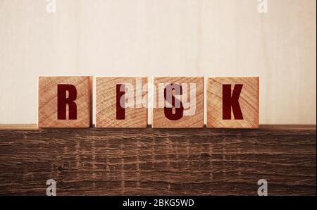 Risk word on wooden blocks. Uncertainty, unpredictable situation crisis and risks management concept