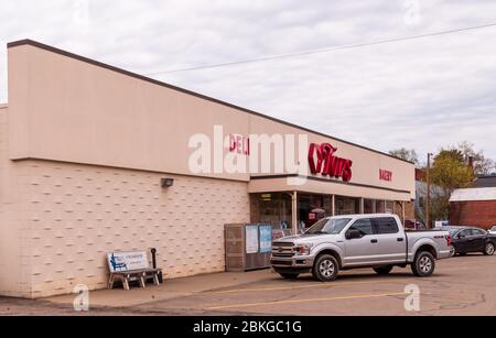 Tops Grocery store, a popular, regional chain with a Ford truck parked out front on an overcast spring day, Youngsville, Pennsylvania, USA Stock Photo