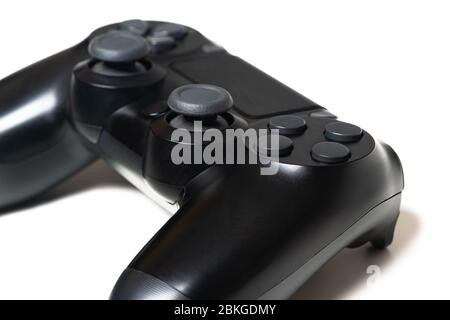 Video game black controller closeup white background Stock Photo