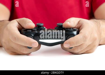 Video game controller in hands white background Stock Photo