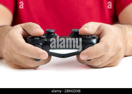 Video game controller in hands white background Stock Photo
