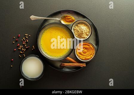 Healthy drink with curcuma and milk. Golden Milk, made with turmeric and other spices Stock Photo