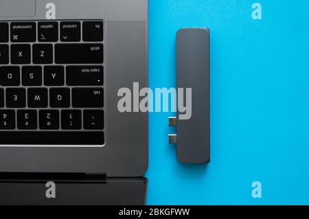 The USB adapter under the Type-C connector for laptop. Multiport station for laptop with multiple different ports. USB to USB Type-C Hub Converter Stock Photo