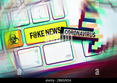 PHOTOMONTAGE, Computer button labeled Fake News and Biogefährdungszeichen, symbol photo for coronavirus hoaxes  /  FOTOMONTAGE, Computertaste mit der Stock Photo