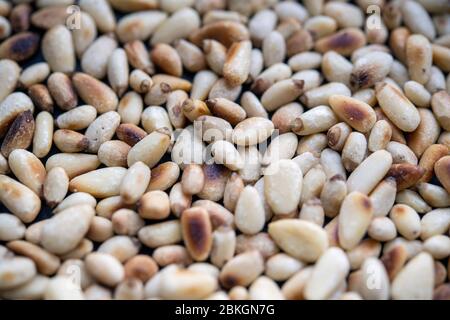 Freshly toasted pine nuts Stock Photo