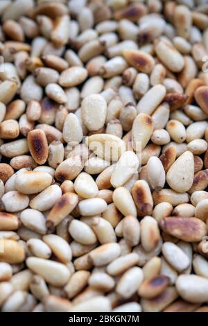 Freshly toasted pine nuts Stock Photo