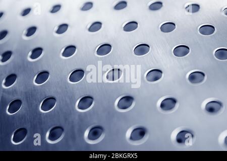 Industrial iron background in blue with professional holes and highlights. Stock Photo