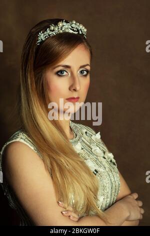 Serious beautiful bride arms folded looking at camera Stock Photo