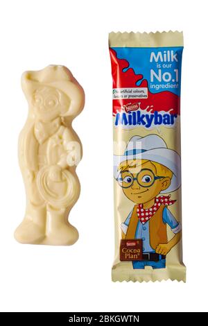 Milkybar small bar of white chocolate wrapped & unwrapped showing Milky bar Kid from Nestle Milky bar selection pack isolated on white background Stock Photo