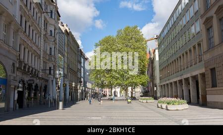 View along Neuhauser Straße on a Sunday morning. Weekdays a popular shopping street. On Sunday usually occupied by tourists. Empty due to Covid-19. Stock Photo