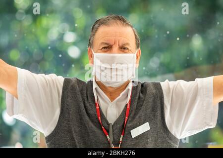 Real people face portraits. People worried while walking in Providencia streets with mask protection because of coronavirus disease infection COVID-19 Stock Photo