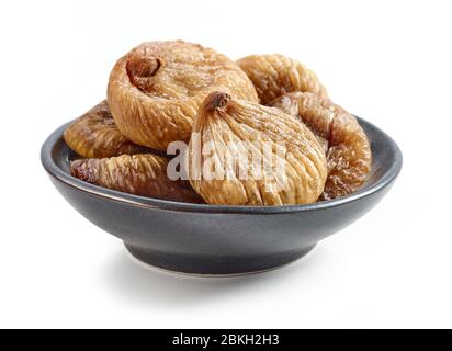bowl of dried figs isolated on white background Stock Photo