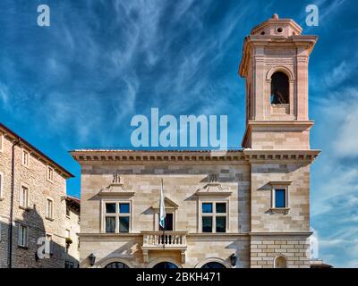 San Marino old town buildings and flags in central square Stock Photo