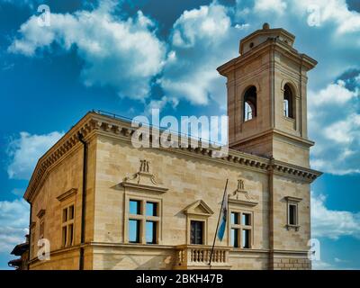 San Marino old town buildings and flags in central square Stock Photo