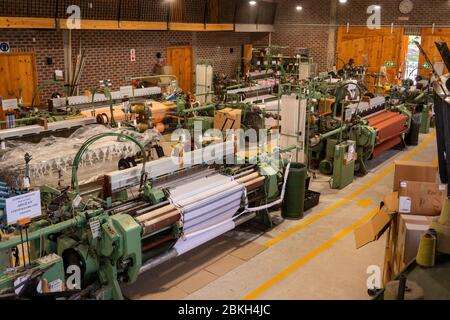 South Africa, Western Cape, Plettenberg Bay, Old Nick Village, Mungo Mill, weaving shed interior, historic looms producing cotton textiles Stock Photo
