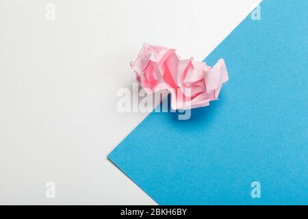 Wadded paper balls on a blue background Stock Photo