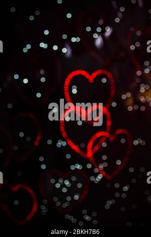 A background image of many hearts created by LED lights and the Bokeh ...