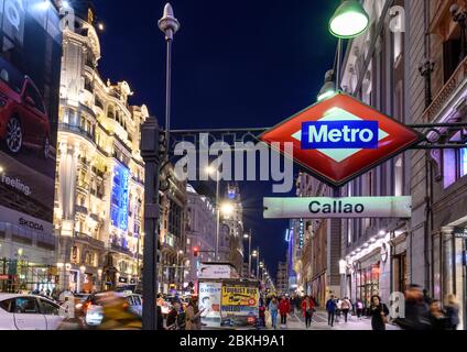 Looking along the Gran Via, in the heart of Madrid's shopping  district,  towards the Telefonica building,  from Callao metro station.  Madrid, Spain Stock Photo