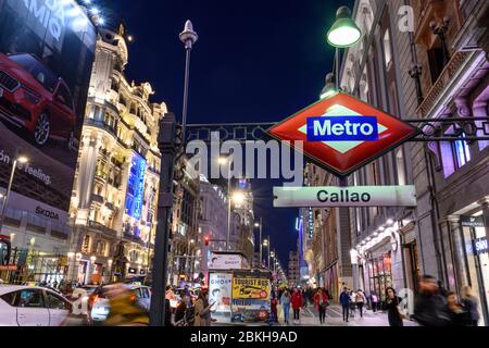 Looking along the Gran Via, in the heart of Madrid's shopping  district,  towards the Telefonica building,  from Callao metro station.  Madrid, Spain Stock Photo