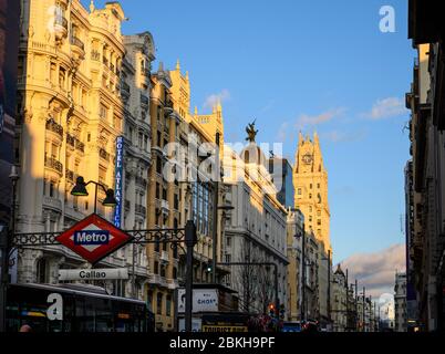 Looking along the Gran Via, in the heart of Madrid's shopping  district,  towards the Telefonica building,  from Callao metro station.  Madrid, Spain Stock Photo