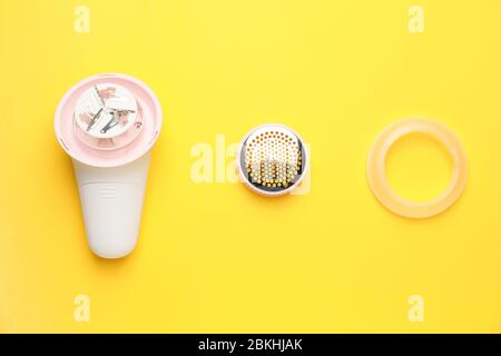 Modern fabric shaver on color background Stock Photo